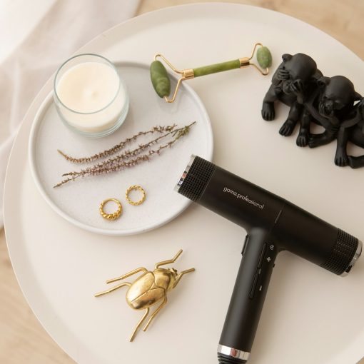 black hair dryer on white round ceramic plate