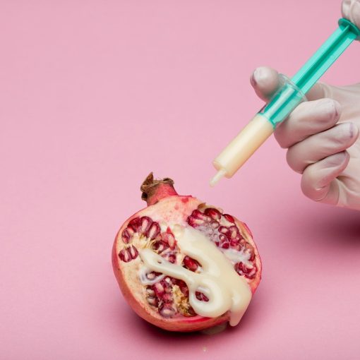 person holding green and white pen