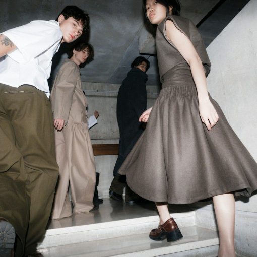 People are descending a staircase together.