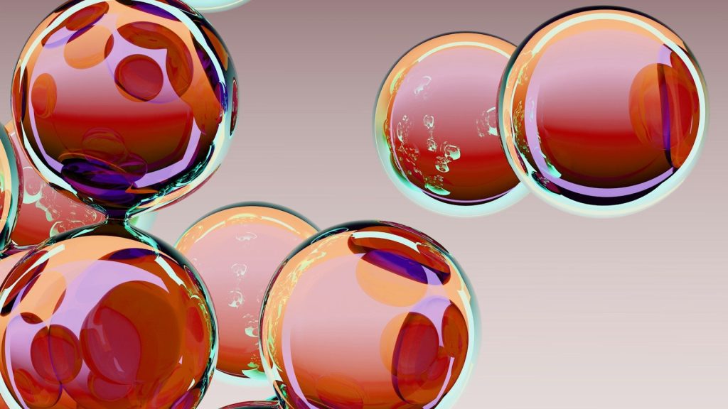 Close-up of translucent red spheres with reflections